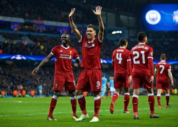 (180411) -- MANCHESTER, April 11, 2018 () -- Liverpool s Roberto Firmino (2nd L) celebrates with his teammate Sadio Mane (1st L) after scoring during the UEFA Champions League quarterfinal second leg soccer match between Manchester City and Liverpool in Manchester, Britain, on April 10, 2018. Liverpool won 5-1 on aggregate and advanced to the semifinal. () FOR EDITORIAL USE ONLY. NOT FOR SALE FOR MARKETING OR ADVERTISING CAMPAIGNS. NO USE WITH UNAUTHORIZED AUDIO, VIDEO, DATA, FIXTURE LISTS, CLUB LEAGUE LOGOS OR LIVE SERVICES. ONLINE IN-MATCH USE LIMITED TO 45 IMAGES, NO VIDEO EMULATION. NO USE IN BETTING, GAMES OR SINGLE CLUB LEAGUE PLAYER PUBLICATIONS.) (SP)BRITAIN-MANCHESTER-SOCCER-UEFA CHAMPIONS LEAGUE-MANCHESTER CITY VS LIVERPOOL Xinhua
