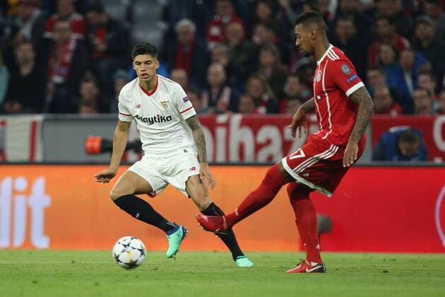In a duel action with Joaquin Correa 11 Sevilla FC and Jerome Boateng 17 FC Bayern Muenchen FC Bayern Muenchen vs Sevilla FC Quarterfinals Champions League 11 04 2018 Muenchen Bayern Germany Copyright: xkolbert-press ChristianxKolbertx