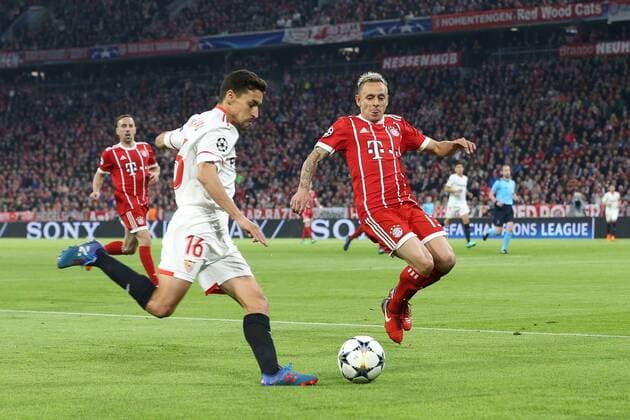 In action with Jesus Navas 16 FC Sevilla and Rafinha 13 Bayern Munich Muenchen FC vs Sevilla FC Quarterfinals Champions League 11 04 2018 Muenchen Bayern Germany Copyright: xkolbert-press ChristianxKolbertx
