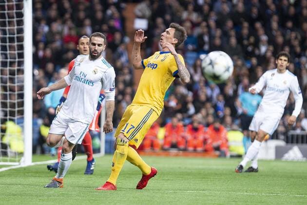 Real Madrid Daniel Carvajal and Juventus Mario Mandzukic during Champion League match between Real Madrid and Juventus at Santiago Bernabeu Stadium in Madrid, Spain. April 11, 2018.  (20180411005)