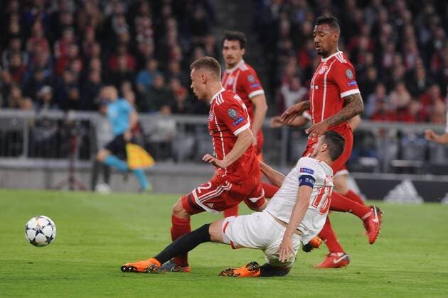 Shot on goal by Sergio Escudero Sevilla 18 Joshua Kimmich Bayern Munich clarifies in the CL match between FC Bayern Muenchen and Sevilla FC 11 04 2018 Muenchen Copyright: xStuetzle xEibner-Pressefotox EP_EER
