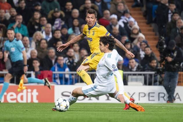 Real Madrid Jesus Vallejo and Juventus Mario Mandzukic during Champion League match between Real Madrid and Juventus at Santiago Bernabeu Stadium in Madrid, Spain. April 11, 2018.  (20180411007)