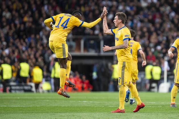 Juventus Blaise Matuidi and Mario Mandzukic celebrating a goal during Champion League match between Real Madrid and Juventus at Santiago Bernabeu Stadium in Madrid, Spain. April 11, 2018.  (20180411014)