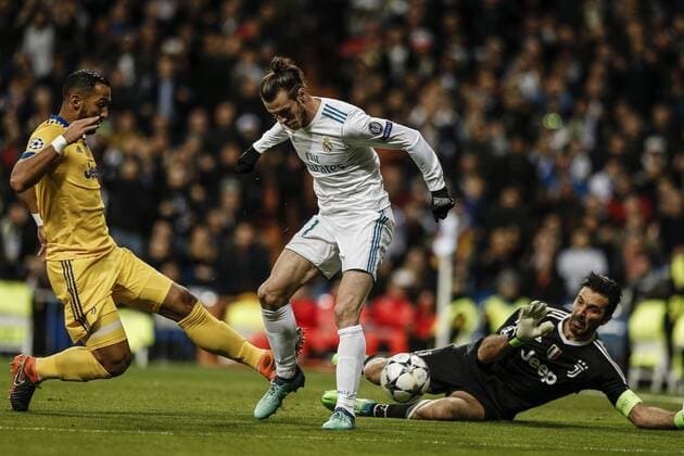 11th April 2018, Santiago Bernabeu, Madrid, Spain; UEFA Champions League football, quarter final, second leg, Real Madrid versus Juventus; Gareth Bale (Real Madrid) goes around Buffon but cannot get his back-heeled shot on goal  ActionPlus12012182