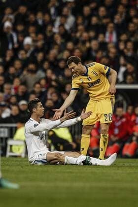 11th April 2018, Santiago Bernabeu, Madrid, Spain; UEFA Champions League football, quarter final, second leg, Real Madrid versus Juventus; Cristiano Ronaldo (Real Madrid) helped up after a hard tackle  ActionPlus12012195