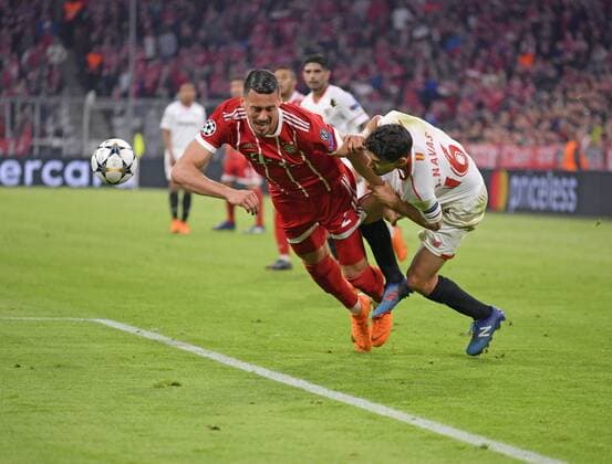 11 04 2018 Football UEFA Champions League 2017 2018 Quarter-finals 2nd leg FC Bayern Munich Sevilla FC at Allianzarena Munich v left Sandro Wagner FC Bayern Munich v Jesus Navas FC Sevilla