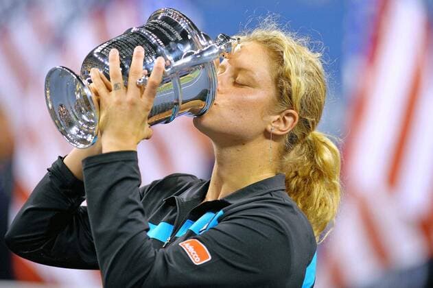 - NEW YORK, USA: Belgian tennis player Kim Clijsters celebrates with her trophy after winning her final match against Russian Vera Zvonareva, during the women s singles at the US Open Grand Slam Tennis Tournament, at Flushing Meadows, in New York City, USA, Saturday 11 September 2010. Clijsters won 6-2, 6-1. PHILIPPExBUISSIN  x22279034x