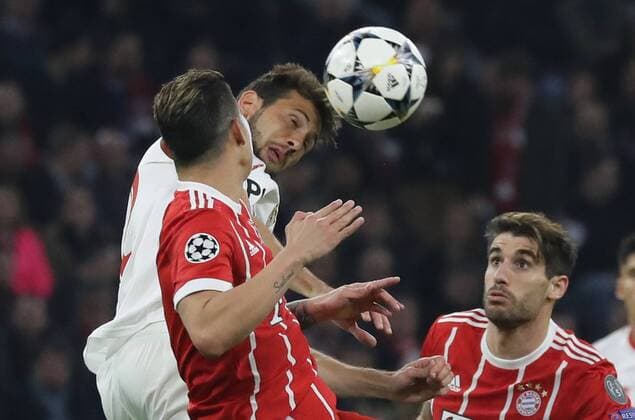 Soccer Champions League FC Bayern Sevilla FC 0 0 Franco Vasquez clears ahead of James Rodriguez and Javi Martinez Munich Bayern Germany Allianz Arena