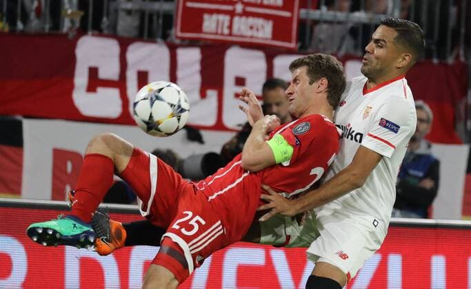 Soccer Champions League FC Bayern Sevilla FC 0 0 Thomas Müller and Gabriel Mercado Munich Bayern Germany Allianz Arena