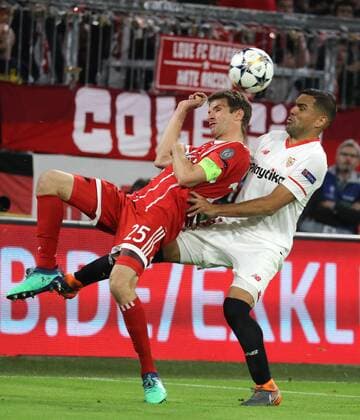 Soccer Champions League FC Bayern Sevilla FC 0 0 Thomas Müller and Gabriel Mercado Munich Bayern Germany Allianz Arena