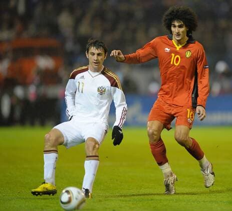 - VORONEZH, RUSSIA: (L-R) Russia s Alan Dzagoev and Belgium s Marouane Fellaini fight for the ball during the friendly soccer match Russia vs Belgium, in Voronezh, Wednesday 17 November 2010. ERICxLALMAND  x23578423x