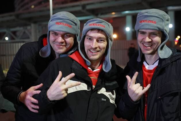 MOSCOW, RUSSIA â€“ APRIL 12, 2018: Arsenal F.C. fans given fur hats as part of the Gentlefan Russian Warm Welcome hospitality programme ahead of Leg 2 of the 2017 18 UEFA Europa League quarterfinal football match between CSKA Moscow and Arsenal F.C., at VEB Arena. Sergei Bobylev TASS  TS07BA04