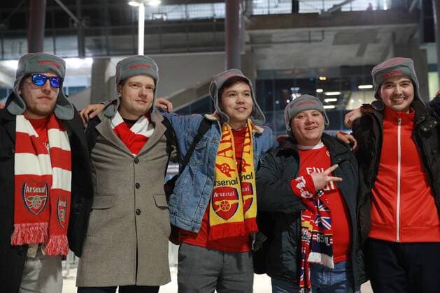 MOSCOW, RUSSIA â€“ APRIL 12, 2018: Arsenal F.C. fans given fur hats as part of the Gentlefan Russian Warm Welcome hospitality programme ahead of Leg 2 of the 2017 18 UEFA Europa League quarterfinal football match between CSKA Moscow and Arsenal F.C., at VEB Arena. Sergei Bobylev TASS  TS07BA08