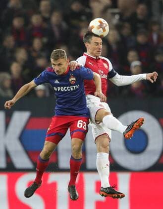 MOSCOW, RUSSIA - APRIL 12, 2018: CSKA Moscow s Fyodor Chalov (L) and Arsenal F.C. s Laurent Koscielny fight for the ball in their 2017-2018 UEFA Europa League quarterfinal second leg football match at VEB Arena (Arena CSKA). Sergei Bobylev TASS  TS07BA36