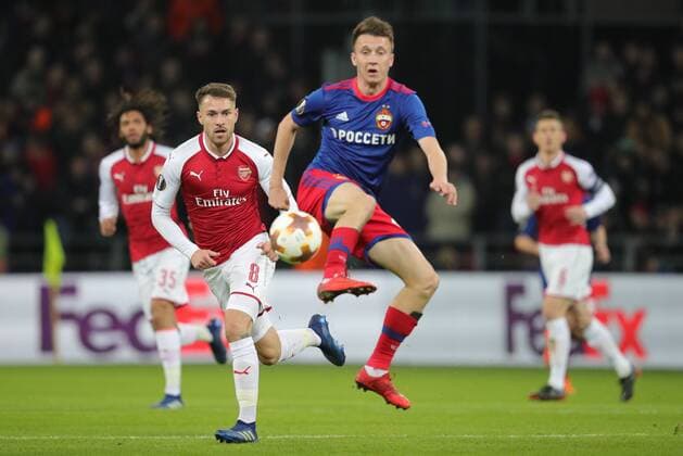 MOSCOW, RUSSIA - APRIL 12, 2018: Arsenal F.C. s Aaron Ramsey (L) and CSKA Moscow s Alexander Golovin in action in their 2017-2018 UEFA Europa League quarterfinal second leg football match at VEB Arena (Arena CSKA). Sergei Bobylev TASS  TS07BA39