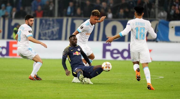 Marseille RB Leipzig Soccer Euro League Marseille 12 04 2018 Stade Velodrome Soccer UEFA Euro League quarter-final second leg Olympique Marseille vs. RB Leipzig In the picture from the left Morgan Sanson 8 Marseille Jean Kevin Augustin 29 RB Leipzig Boubacar Kamara 4 Marseille and Jordan Amavi 18 Marseille