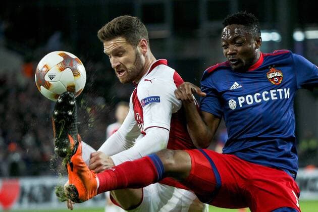 MOSCOW, RUSSIA - APRIL 12, 2018: Arsenal F.C. s Shkodran Mustafi (L) and CSKA Moscow s Ahmed Musa fight for the ball in their 2017-2018 UEFA Europa League quarterfinal second leg football match at VEB Arena (Arena CSKA). Mikhail Tereshchenko TASS  TS07BA47