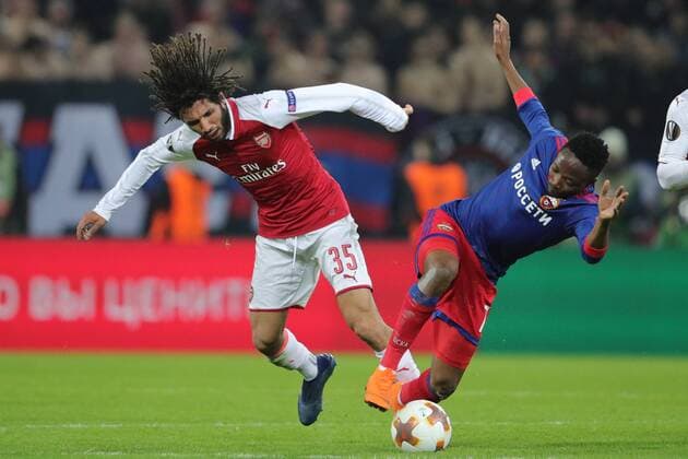 MOSCOW, RUSSIA - APRIL 12, 2018: Arsenal F.C. s Mohamed Elneny (L) and CSKA Moscow s Ahmed Musa in action in their 2017-2018 UEFA Europa League quarterfinal second leg football match at VEB Arena (Arena CSKA). Sergei Bobylev TASS  TS07BA4F