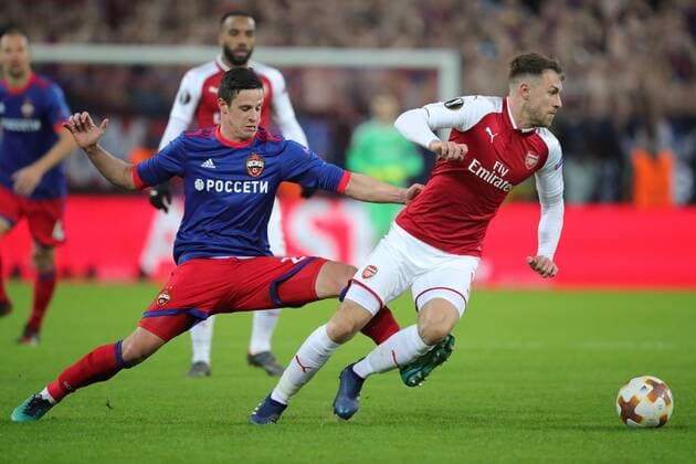 MOSCOW, RUSSIA - APRIL 12, 2018: CSKA Moscow s Kristijan Bistrovic (L) and Arsenal F.C. s Aaron Ramsey fight for the ball in their 2017-2018 UEFA Europa League quarterfinal second leg football match at VEB Arena (Arena CSKA). Sergei Bobylev TASS  TS07BA51