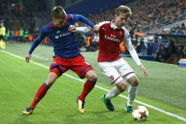 MOSCOW, RUSSIA - APRIL 12, 2018: CSKA Moscow s Kirill Nababkin (L) and Arsenal F.C. s Nacho Monreal in action in their 2017-2018 UEFA Europa League quarterfinal second leg football match at VEB Arena (Arena CSKA). The game ended in a 2-2 draw. Mikhail Tereshchenko TASS  TS07BA56