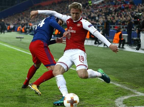 MOSCOW, RUSSIA - APRIL 12, 2018: CSKA Moscow s Kirill Nababkin (L) and Arsenal F.C. s Nacho Monreal in action in their 2017-2018 UEFA Europa League quarterfinal second leg football match at VEB Arena (Arena CSKA). The game ended in a 2-2 draw. Mikhail Tereshchenko TASS  TS07BA57