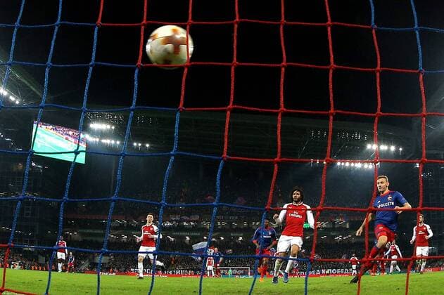 MOSCOW, RUSSIA - APRIL 12, 2018: CSKA Moscow s Fyodor Chalov and Arsenal F.C. s Mohamed Elneny (R-L) in their 2017-2018 UEFA Europa League quarterfinal second leg football match at VEB Arena (Arena CSKA). The game ended in a 2-2 draw. Sergei Bobylev TASS  TS07BA5E