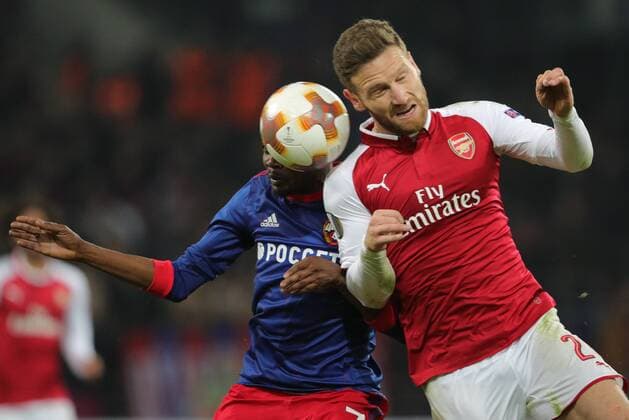 MOSCOW, RUSSIA - APRIL 12, 2018: CSKA Moscow s Ahmed Musa (L) and Arsenal F.C. s Shkodran Mustafi fight for the ball in their 2017-2018 UEFA Europa League quarterfinal second leg football match at VEB Arena (Arena CSKA). The game ended in a 2-2 draw. Sergei Bobylev TASS  TS07BA5F