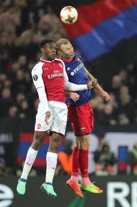 MOSCOW, RUSSIA - APRIL 12, 2018: Arsenal F.C. s Danny Welbeck (L) and CSKA Moscow s Alexei Berezutsky in action in their 2017-2018 UEFA Europa League quarterfinal second leg football match at VEB Arena (Arena CSKA). The game ended in a 2-2 draw. Sergei Bobylev TASS  TS07BA60