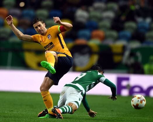 (180413) -- LISBON, April 13, 2018 -- Marcos Acuna (R) of Sporting vies with Gabi of Atletico during the Europa League quarterfinal second leg soccer match between Sporting CP and Club Atletico de Madrid at the Jose Alvalade stadium in Lisbon, Portugal, on April 12, 2018. Sporting won 1-0 but was eliminated by a 1-2 on aggregate. ) (SP)PORTUGAL-LISBON-SOCCER-UEFA EUROPA LEAGUE-QUARTERFINAL-ATLETICO VS SPORTING ZhangxLiyun 