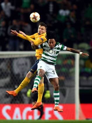 (180413) -- LISBON, April 13, 2018 -- Saul Niguez (L) of Atletico vies with Gelson Martins of Sporting during the Europa League quarterfinal second leg soccer match between Sporting CP and Club Atletico de Madrid at the Jose Alvalade stadium in Lisbon, Portugal, on April 12, 2018. Sporting won 1-0 but was eliminated by a 1-2 on aggregate. ) (SP)PORTUGAL-LISBON-SOCCER-UEFA EUROPA LEAGUE-QUARTERFINAL-ATLETICO VS SPORTING ZhangxLiyun 