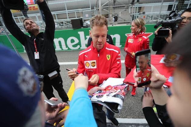 German F1 Sebastian Vettel of Ferrari signs autographs for fans at the Shanghai International Circuit before the 2018 Formula 1 Chinese Grand Prix in Shanghai, China, 12 April 2018. F1 drivers wow fans with signatures and selfies in Shanghai  20180412_61007