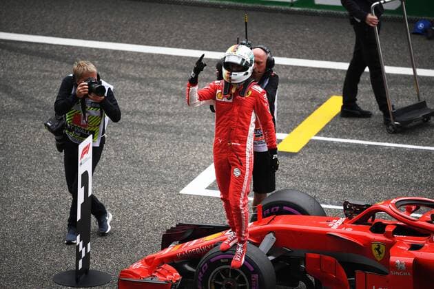 German F1 Sebastian Vettel of Ferrari reacts after winning the pole position in the qualifying session for the 2018 Formula One Chinese Grand Prix at the Shanghai International Circuit in Shanghai, China, 14 April 2018. It s still early, but it looks like Ferrari is back. Ferrari s Sebastian Vettel claimed pole position for Sunday s Chinese Grand Prix, where the German will be going for his third straight victory to open the Formula One season. Vettel and Ferrari teammate Kimi Raikkonen will start on the first row in Shanghai. Mercedes, which has dominated the last four seasons, will start on the second row with Valtteri Bottas ahead of No. 4 Lewis Hamilton - the defending and four-time series champion. The famous Italian team has not won a season title in 11 years with Kimi Raikkonen champion in 2007. But Bottas is already hinting that rival Ferrari is the team to beat. Vettel takes pole in China, and Ferrari looks like it s back 