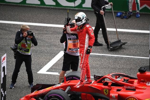 German F1 Sebastian Vettel of Ferrari reacts after winning the pole position in the qualifying session for the 2018 Formula One Chinese Grand Prix at the Shanghai International Circuit in Shanghai, China, 14 April 2018. It s still early, but it looks like Ferrari is back. Ferrari s Sebastian Vettel claimed pole position for Sunday s Chinese Grand Prix, where the German will be going for his third straight victory to open the Formula One season. Vettel and Ferrari teammate Kimi Raikkonen will start on the first row in Shanghai. Mercedes, which has dominated the last four seasons, will start on the second row with Valtteri Bottas ahead of No. 4 Lewis Hamilton - the defending and four-time series champion. The famous Italian team has not won a season title in 11 years with Kimi Raikkonen champion in 2007. But Bottas is already hinting that rival Ferrari is the team to beat. Vettel takes pole in China, and Ferrari looks like it s back 