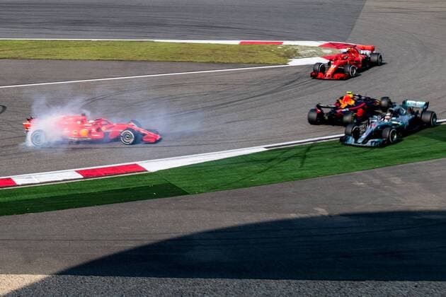 German F1 Sebastian Vettel of Ferrari and Dutch F1 driver Max Verstappen of Red Bull Racing collide as they compete during the 2018 Formula One Chinese Grand Prix at the Shanghai International Circuit in Shanghai, China, 15 April 2018. Daniel Ricciardo charged from sixth to score a stunning first win of the 2018 Formula 1 season as Max Verstappen and Sebastian Vettel collided in a wild Chinese Grand Prix. Bottas and Vettel were locked in their own battle for the win until Ricciardo and Verstappen pitted again for fresh, soft tyres during a safety car period just after the halfway mark as their rivals stayed on mediums. Ricciardo then overtook his team-mate, Lewis Hamilton and Vettel in quick succession before executing a stunning pass on Bottas into the tight Turn 6 right-hander for the victory. Verstappen and Vettel collide in Chinese Grand Prix 