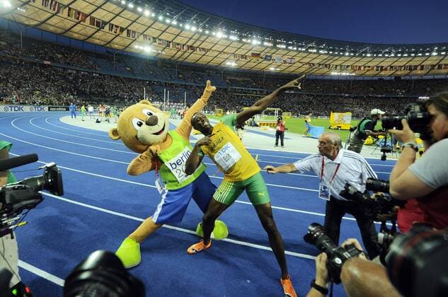 - BERLIN, GERMANY: Jamaican Usain Bolt and Berlino the mascotte do the typical Bolt move, after Bolt won the men s 200m final at the 12th IAAF World Championships of Athletics in the Olympic Stadium of Berlin, Thursday 20 August 2009, in Germany. Bolt established a new world record in 19sec19. DIRKxWAEM  x15073203x