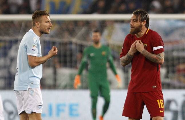 Italy: Soccer Serie A: Lazio and Roma draw 0-0 Lazio s Ciro Immobile, left, and Roma s Daniele De Rossi argue during the Serie A soccer match between Lazio and Roma at the Olympic stadium. Rome Italy  RiccardoxDexLuca PacificxPress