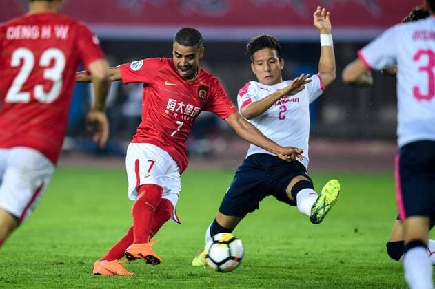 Brazilian football player Alan Carvalho of China s Guangzhou Evergrande Taobao FC shoots to score a goal against Japan s Cerezo Osaka FC in their Group G match during the 2018 AFC Champions League in Guangzhou city, south China s Guangdong province, 17 April 2018. Brazilian striker Alan Carvalho scored twice in the second half to help Guangzhou Evergrande beat the visiting side Cerezo Osaka from Japan 3-1 in a Group G game, final round of the AFC Champions League group stage on Tuesday night. After this game, Guangzhou Evergrande remained unbeaten in this group, earning 12 points and place the first to progress to the knock-out stage of the AFC Champions League, while Buriram United from Thailand managed a 1-0 win over home team Jeju United from South Korea and secured another place in the knock-out stage. Huang Bowen broke the deadlock for Guangzhou Evergrande early in the fifth minute, as the 30-year-old midfielder received the pass from Li Xuepeng, got away from defenders in the penalty area and scored the opening goal. Guangzhou Evergrande beat Cerezo Osaka 3-1 in AFC Champions League  20180417_88963