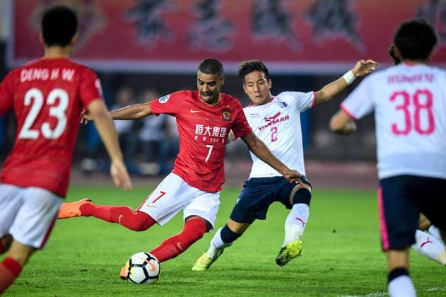 Brazilian football player Alan Carvalho of China s Guangzhou Evergrande Taobao FC shoots to score a goal against Japan s Cerezo Osaka FC in their Group G match during the 2018 AFC Champions League in Guangzhou city, south China s Guangdong province, 17 April 2018. Brazilian striker Alan Carvalho scored twice in the second half to help Guangzhou Evergrande beat the visiting side Cerezo Osaka from Japan 3-1 in a Group G game, final round of the AFC Champions League group stage on Tuesday night. After this game, Guangzhou Evergrande remained unbeaten in this group, earning 12 points and place the first to progress to the knock-out stage of the AFC Champions League, while Buriram United from Thailand managed a 1-0 win over home team Jeju United from South Korea and secured another place in the knock-out stage. Huang Bowen broke the deadlock for Guangzhou Evergrande early in the fifth minute, as the 30-year-old midfielder received the pass from Li Xuepeng, got away from defenders in the penalty area and scored the opening goal. Guangzhou Evergrande beat Cerezo Osaka 3-1 in AFC Champions League  20180417_08989