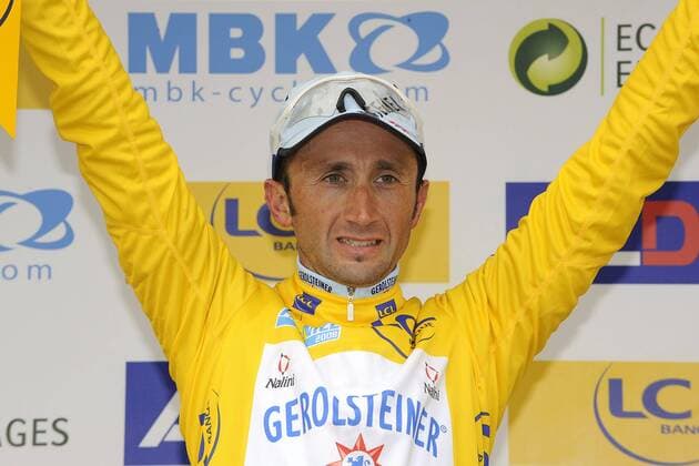 - CANNES, FRANCE : Italian Davide Rebellin celebrates in the yellow leader s jersey after the sixth stage of the Paris-Nice cycling race between Sisteron and Cannes (206 km), Saturday 15 March 2008. LUCxCLAESSEN  x8729448x