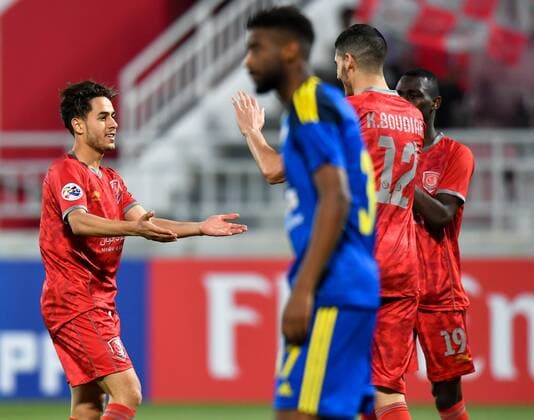 (180418) -- DOHA, April 18, 2018 -- Abdelrahman Fahmi (L) of Al Duhail SC celebrates after scoring the first goal against UAE s Al Wahda FSCC during the AFC Champions League Group B soccer match between Qatar s AL Duhail SC and UAE s Al Wahda FSCC at Abdullah bin Khalifa Stadium in Doha, Qatar, April 17, 2018. Al Duhail won 1-0. ) (SP)QATAR-DOHA-SOCCER-AFC CHAMPIONS Nikku 