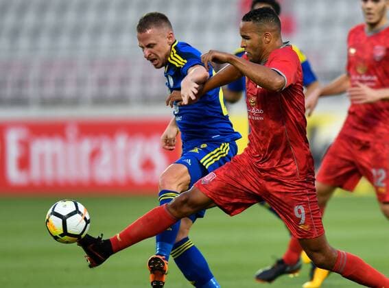 (180418) -- DOHA, April 18, 2018 -- Youssef El-Arabi (R) of Al Duhail SC vies for the ball with Balazs Dzsudzsak of Al Wahda FSCC during the AFC Champions League Group B soccer match between Qatar s AL Duhail SC and UAE s Al Wahda FSCC at Abdullah bin Khalifa Stadium in Doha, Qatar, April 17, 2018. Al Duhail won 1-0. ) (SP)QATAR-DOHA-SOCCER-AFC CHAMPIONS Nikku 