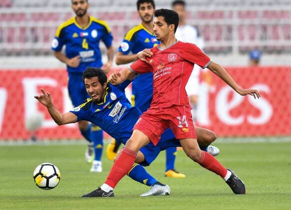 (180418) -- DOHA, April 18, 2018 -- Abdullah Al Ahrak (R) of Al Duhail SC vies for the ball with Mohamed Barghash Al Menhali of Al Wahda FSCC during the AFC Champions League Group B soccer match between Qatar s AL Duhail SC and UAE s Al Wahda FSCC at Abdullah bin Khalifa Stadium in Doha, Qatar, April 17, 2018. Al Duhail won 1-0. ) (SP)QATAR-DOHA-SOCCER-AFC CHAMPIONS Nikku 