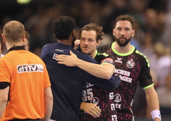 Photo after the kickoff Kentin Mahe Flensburg hugs Theophile Causse Handball men at 18 04 2018 Champions League SG Flensburg Montpellier 28 28