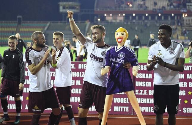 Football Mens Season 2017 2018 Semifinals in the Berlin Pilsner Cup BFC Dynamo Tennis Borussia Bilal Cubukcu BFC Dynamo Vincent Rabiega BFC Dynamo with rubber doll from the fan block in the jersey of Hans Rosenthal Elf was TeBe fan Solomon Okoronkwo BFC Dynamo cheering after the final whistle 18 04 2018 Copyright: xMatthiasxKochx