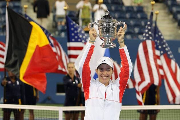 20070908 - NEW YORK, USA: Belgian Justine Henin celebrates with her trophy after defeating Russian Svetlana Kuznetsova in the US Open Women s final at the USTA National Tennis Center in Flushing Meadows, New York, 08 September 2007. It s the 7th Grand Slam title that she won in her carreer and it is the second time that she won the US Open. Henin won with 6-1,6-3. PHILIPPExBUISSIN  x7390033x