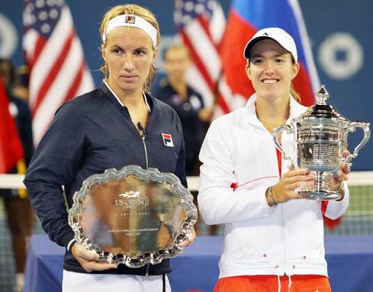 - NEW YORK, USA: (L-R) Russian Svetlana Kuznetsova and Belgian winner Justine Henin celebrate with their trophy after winning the US Open Women s final at the USTA National Tennis Center in Flushing Meadows, New York, 08 September 2007. It s the 7th Grand Slam title that Henin won in her carreer and it is the second time that she won the US Open. Henin won with 6-1,6-3. PHILIPPExBUISSIN  x7390180x