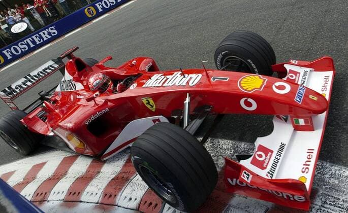 BRU38 - - FRANCORCHAMPS, BELGIUM : German Formula One World Champion Michael Schumacher steers his Ferrari car during the qualifying practice of the Belgian F1 Grand Prix, 31 August 2002, on the race track of Spa - Francorchamps. German Michael Schumacher clocked 1 min 43, 726 to qualify ahead of Finnish Mc Laren driver Kimi Raikkonen. OLIVIERxHOSLET  x1034123x