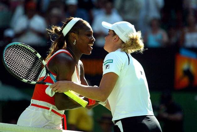NO MAGS-NO SALES-NO INTERNET BRU16 - - MELBOURNE, AUSTRALIA : Fourth seeded Kim Clijsters of Belgium is kissed by her opponant she was defeated by top seeded Serena Williams of the US in their semi-final match at the Australian Open tennis tournament in Melbourne, 23 January 2003. Serena Williams defeated Clijsters 4-6, 6-3, 7-5. PHILIPPExBUISSIN  x1153582x