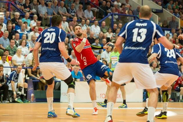 Rene Drechsler 93 Wilhelmshavener HV to throw against Csaba Szücs 20 Bergischer HC and Kristian Nippes 13 Bergischer HC to Bergischer HC vs Wilhelmshavener HV Handball 2 Bundesliga 20 04 18 Solingen NRW Germany Klingenhalle Copyright: xcdnx