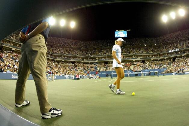BRU32 - 20030907 - NEW YORK, USA : Winner Justine Henin-Hardenne prepares to serve to Kim Clijsters of Belgium during the women s final at the 2003 US Open tennis championships, in Flushing Meadows, New York, Saturday 06 September 2003. Second seed Henin-Hardenne defeated world number one Clijsters 7-5, 6-1 to win her first US Open tennis title.  x1377319x